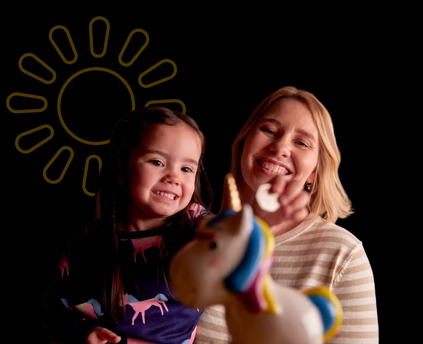 Mother & daughter smiling, putting money in a piggy bank, representing how they're making back the cost of their solar panels.